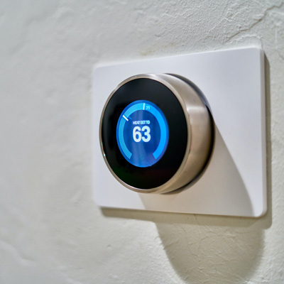smart thermostat on white wall